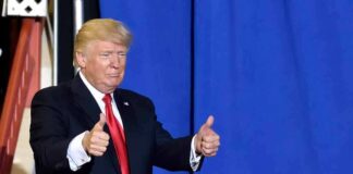 I don't know who this is, man in suit with thumbs up.