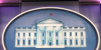 The White House emblem with blue background.