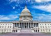 U.S. Capitol building with clear blue sky background.