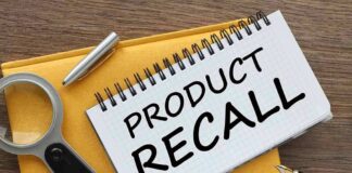 Notebook with product recall text magnifying glass pen