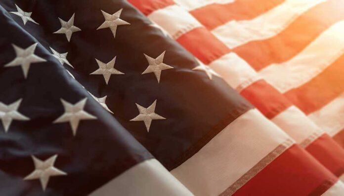 1071381386 featured image Close-up of American flag with sunlit background.