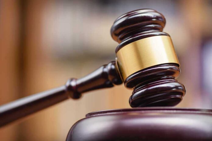 1334292137 featured image Wooden gavel hitting block in courtroom setting