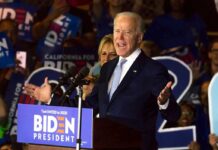 Man speaking at Biden campaign rally