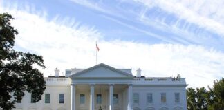 White House with fountain and cloudy sky