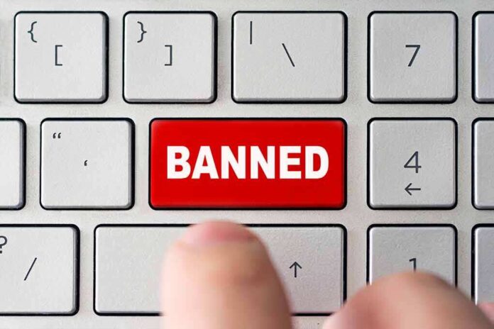 1790081768 featured image Finger pressing banned key on keyboard