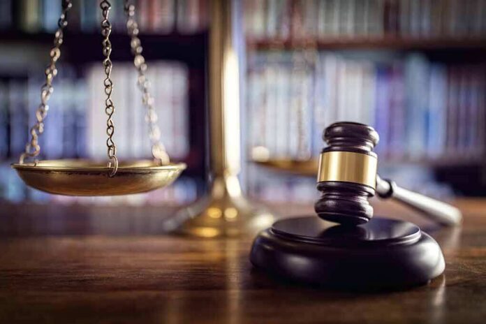 376319674 featured image Gavel and scales of justice on desk.
