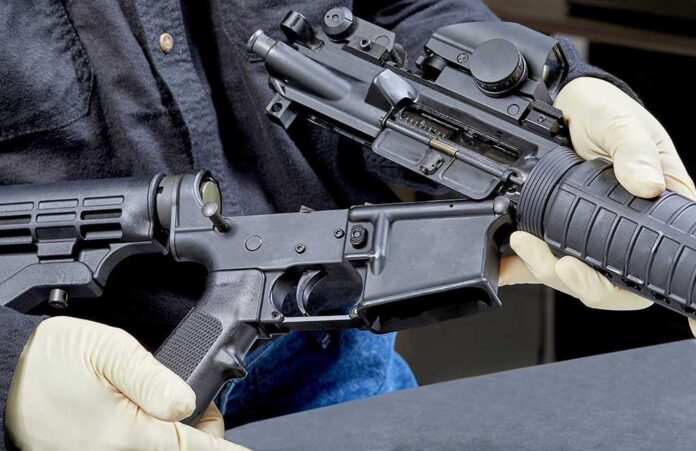 1088730455 featured image Person assembling a black rifle with gloves on