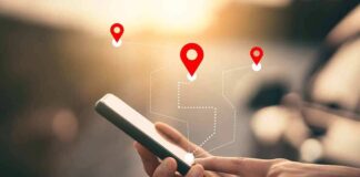 Hands using smartphone with map location icons