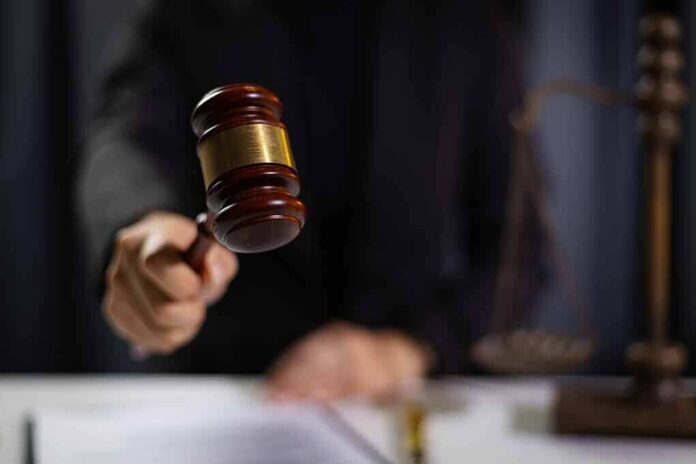 2477750649 featured image Gavel being struck by a judge in courtroom.