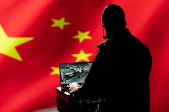 2571639801 featured image Person using laptop with Chinese flag background