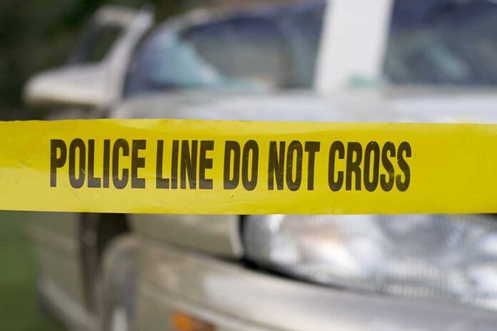 3358598 featured image Yellow police tape in front of a car