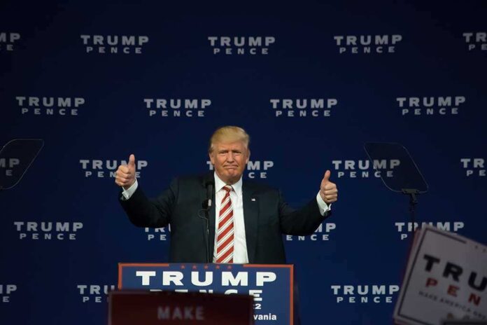 487546267 featured image Man giving thumbs up at Trump Pence rally