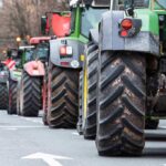 Tractors lined up on a city street