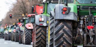 Tractors lined up on a city street