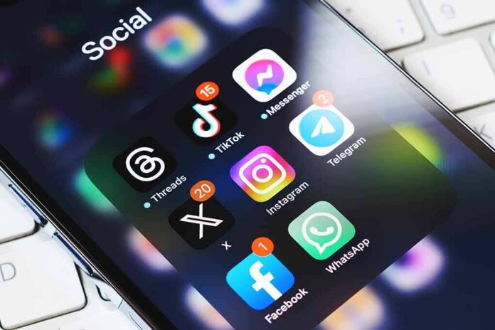 2339442245 featured image Smartphone showing social media app icons in a folder