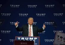 Man giving thumbs up at Trump Pence rally