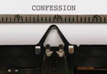 Typewriter with CONFESSION on paper