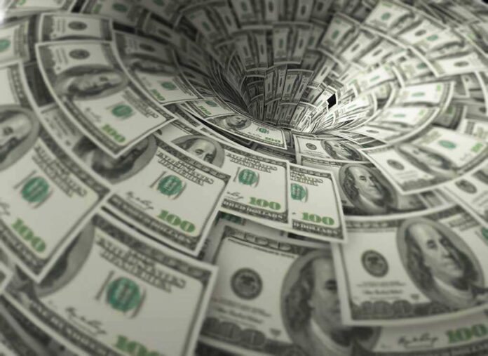 760572118 featured image Hundreddollar bills swirling into a financial vortex