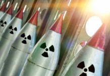 Line of nuclear missiles with radiation hazard signs