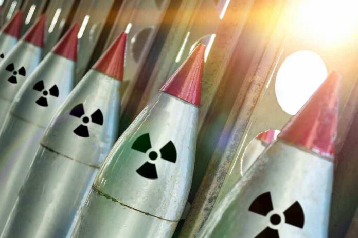 Line of nuclear missiles with radiation hazard signs