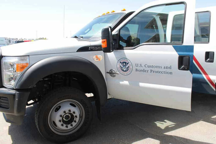 1434041024 US Customs and Border Protection truck with open door