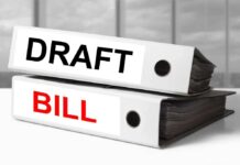 Two binders labeled Draft and Bill