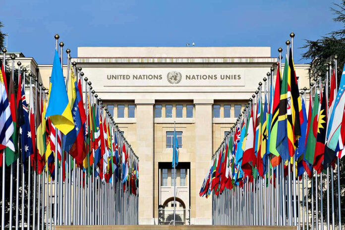 423802144 United Nations building with numerous national flags outside
