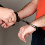 Person handcuffing another persons wrists