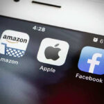 Amazon Apple Facebook apps on smartphone screen