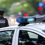 Dentist EXECUTES Wife and Daughter — Unthinkable Horror Police car and officer on a city street.