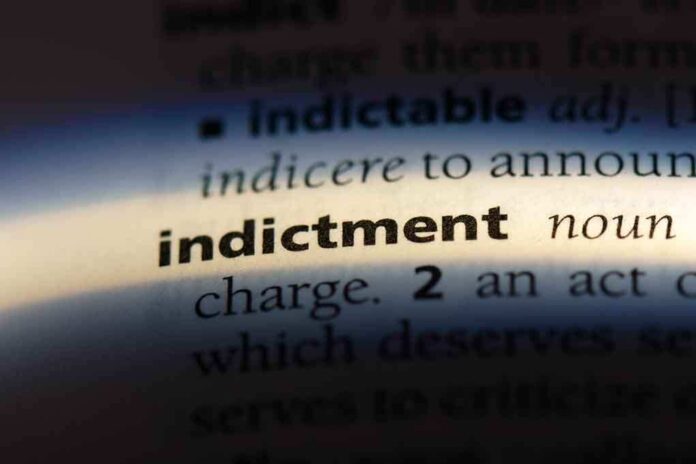 Close-up of a dictionary page showing the definition of indictment
