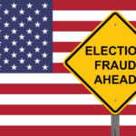 Yellow sign reading Election Fraud Ahead with American flag.