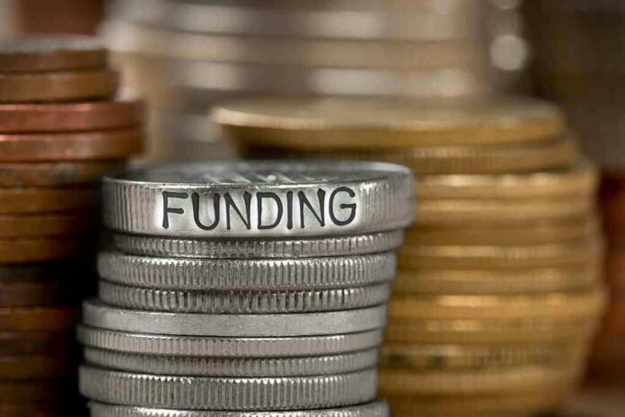 Stack of coins labeled funding with other coins stacks
