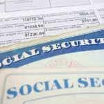Close-up of social security cards and tax documents showing financial information