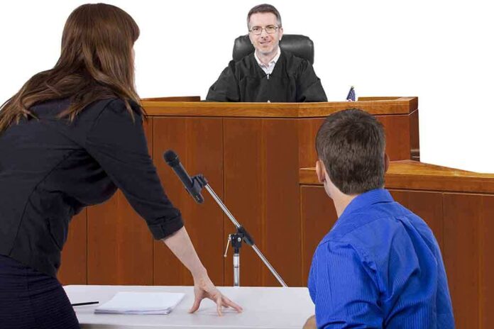 A judge presiding over a courtroom with a lawyer speaking to the court