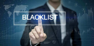 Man pressing virtual blacklist button.