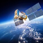 A satellite equipped with solar panels orbiting above the Earth