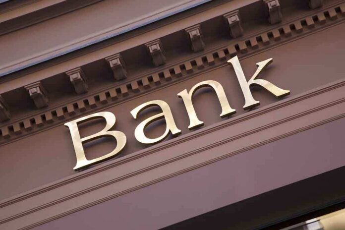 Close-up of a bank sign with gold lettering