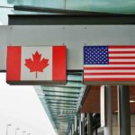Canada DESTROYED— 46-Year Curse BROKEN! Canadian and American flags displayed at a border crossing