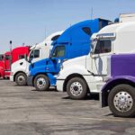 ICE Grabs DRIVER After Deadly Indiana Truck Crash A lineup of colorful trucks parked in a lot