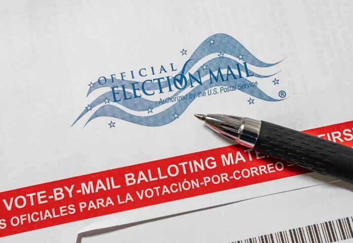 Official election mail envelope with a pen beside it