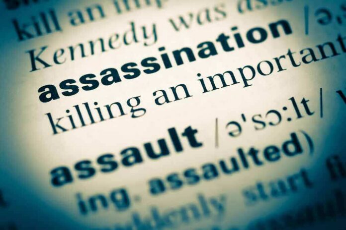 Close-up of a dictionary page showing the definition of assassination