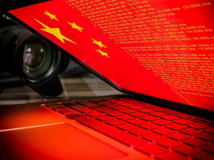 Laptop screen displaying Chinese flag and code.
