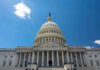 Congress RECESSING — What About the SHUTDOWN! U.S. Capitol building against a clear blue sky.