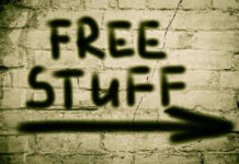 Graffiti on brick wall says free stuff arrow