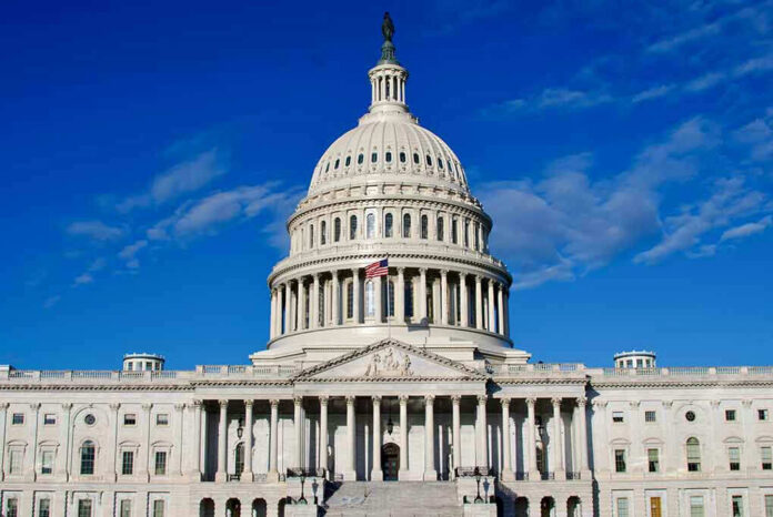 US Capitol Building against blue sky.