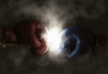 Red and blue boxing gloves clashing with smoke.