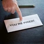 DHS Boss SACKED–WHY Revealed Envelope with YOURE FIRED and pointing finger.