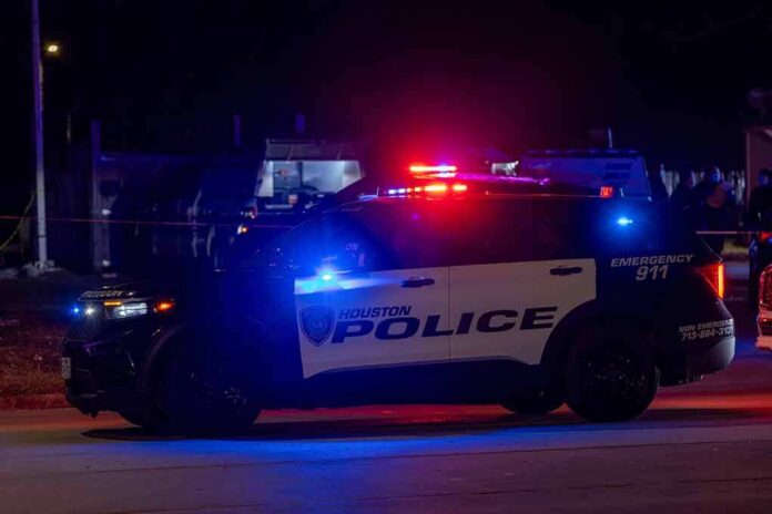 Houston police vehicle with emergency lights activated at night