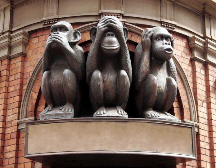 shutterstock_2749281.jpg Three monkey sculptures representing see no evil, hear no evil, and speak no evil